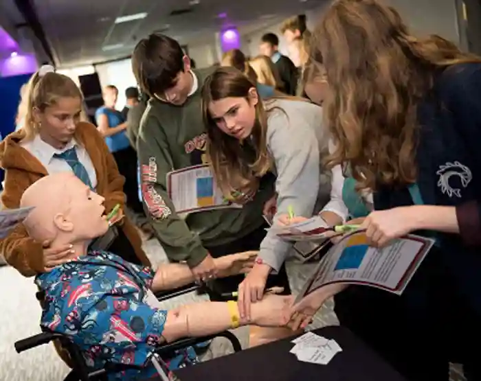 School students taking part in a patient simulation experiment at the Schools Outreach Workshop during SfE BES 2019.